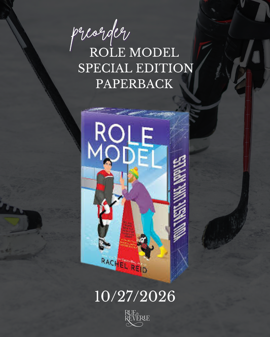 Promotional graphic for the paperback edition of the book 'Role Model' by Rachel Reid, featuring the illustrated book cover centered over a dark hockey-themed background with skates and sticks. Text reads 'precorder ROLE MODEL SPECIAL EDITION PAPERBACK' and the date '10/27/2026'.